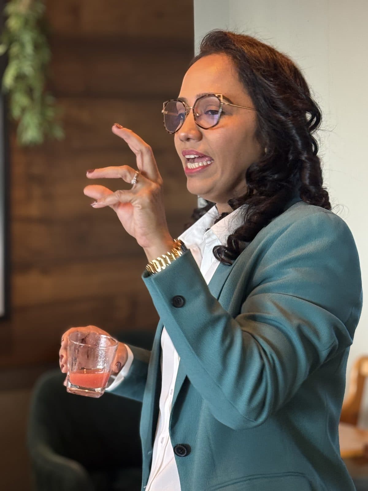 Dr. Sharuja speaking and gesturing during a workshop session